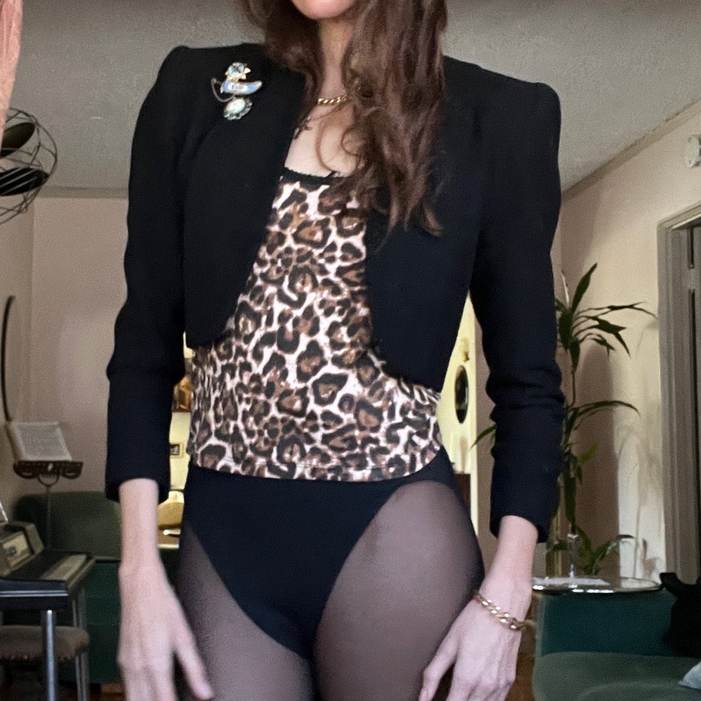 vintage cropped blazer with strong shoulders and brooches